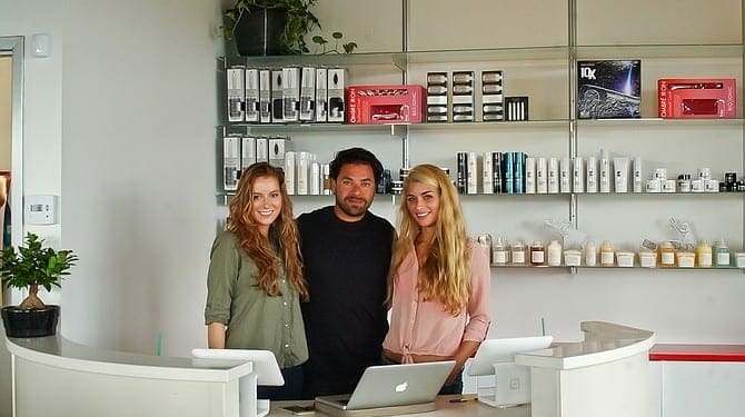 Asad Alkurabi, along with Music to My Hair Salon manager Ashley Millet, left, and receptionist Michelle Vargason, right, prepare to open the new salon, which will offer a place for musicians and artists to show their work in addition to trying a different hairstyle