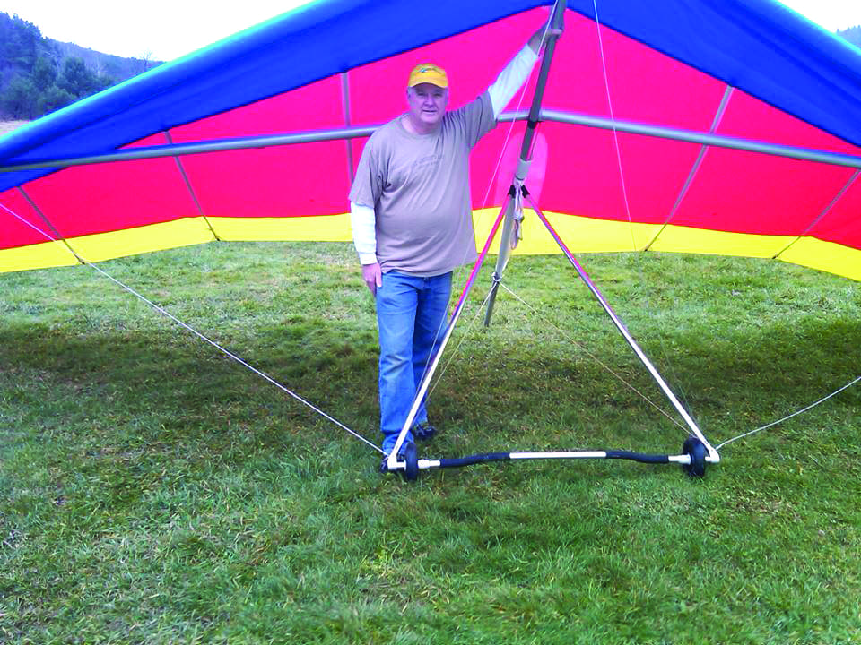 Gary Casper stands with his current glider. The 62-year-old from Clifton Park returned to hang gliding four years ago after taking more than 30 years off from the sport. Submitted photo