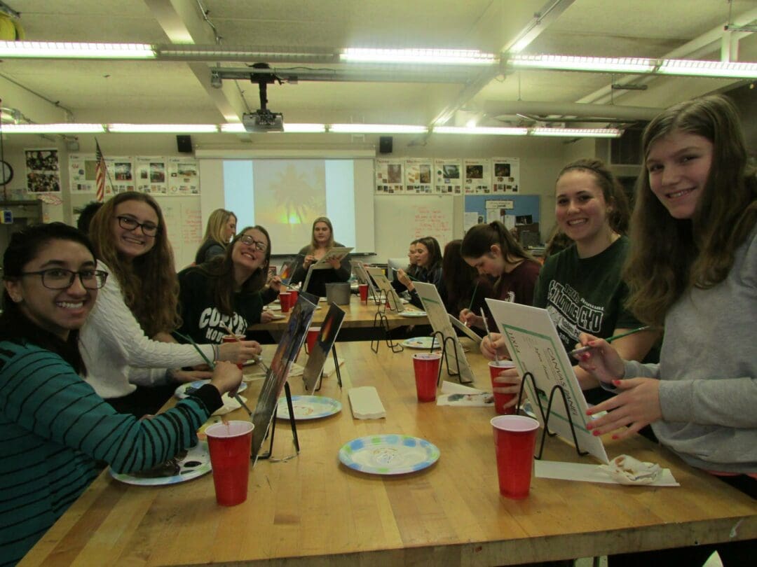 A group of Bethlehem Central High School students smile as they paint during a previous Girls Night Out.  Submitted photo