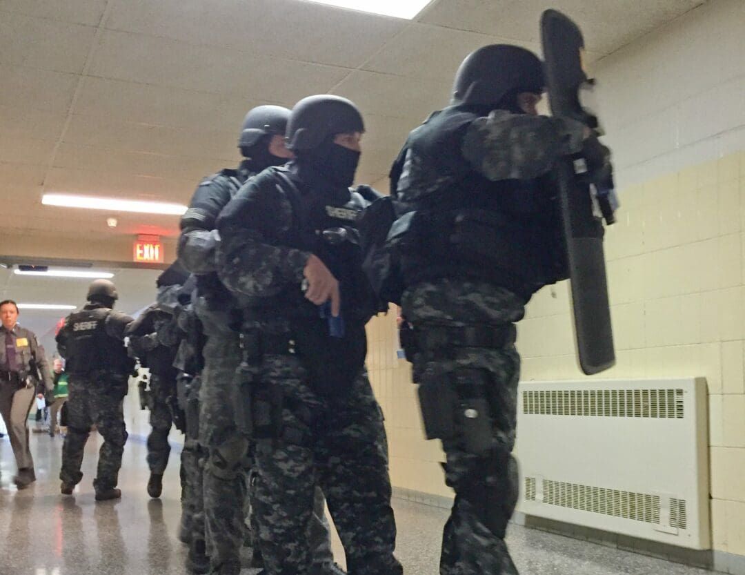 A SWAT team prepares to strike during an active response exercise held at Voorheesville High School on Thursday, March 24.  Tricia Cremo/Spotlight