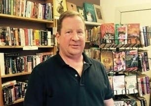 John Keefe, owner of Saratoga Book Warehouse, is pushing to give away 20,000 books to kids this year. Submitted photo