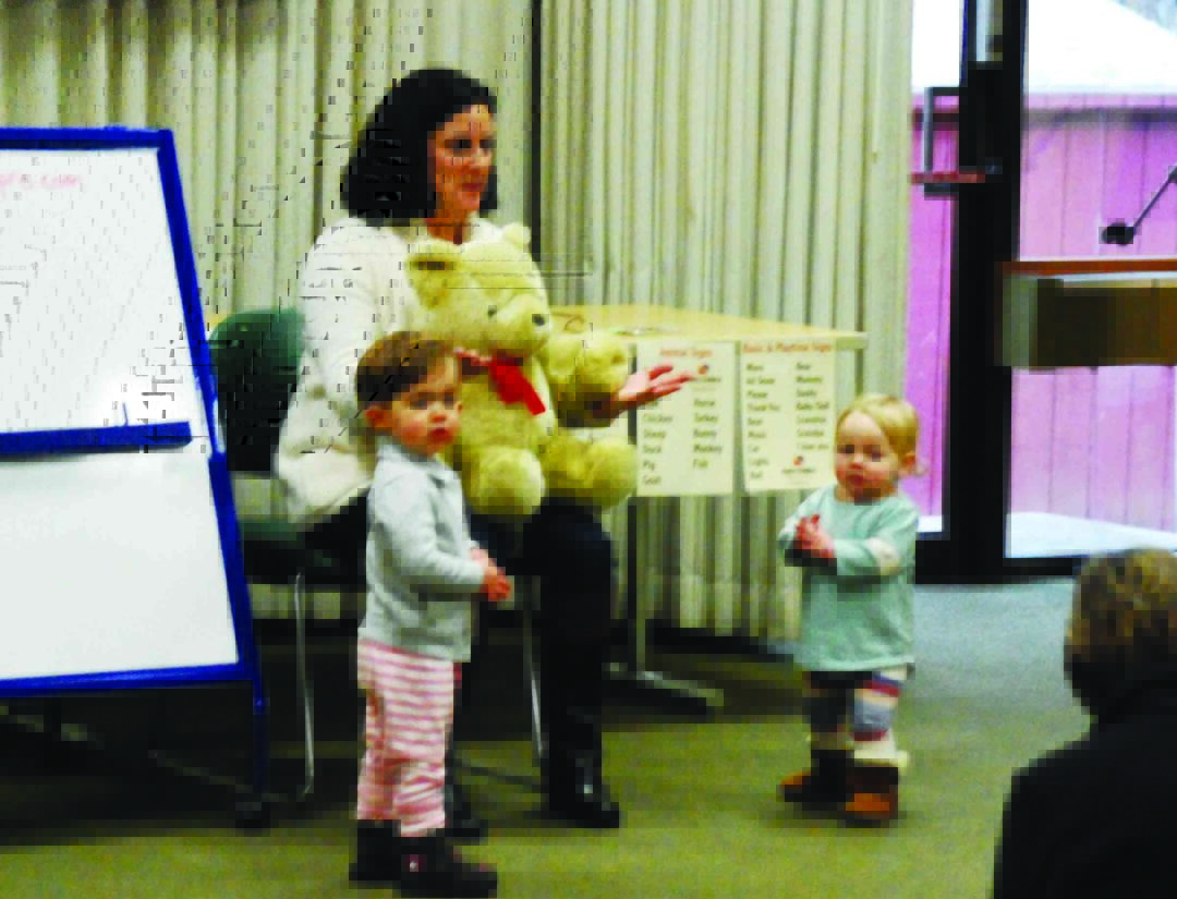 Rebecca Demarest of Happy Babble interacts with a couple of toddlers in a recent sign language class at Bethlehem Public Library.