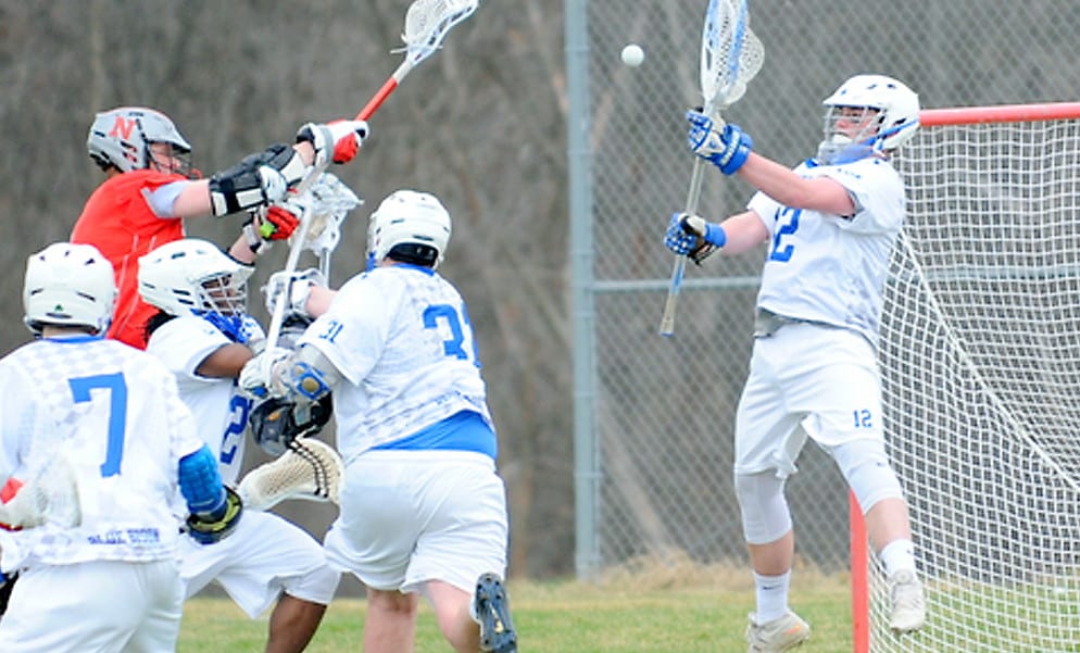 Shaker goaltender Andrew Leahey leaps to make a save during a March 31 Suburban Council game against Niskayuna in Latham. Robert Goo/www.goosphotos.com