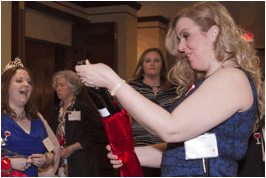 Elizabeth Gruen from CBS6 selects a bottle of wine from the Mystery Wine Pull at the 11th Annual Warmth of Wine on Thursday, Feb. 25, at the Century House.
Photo submitted