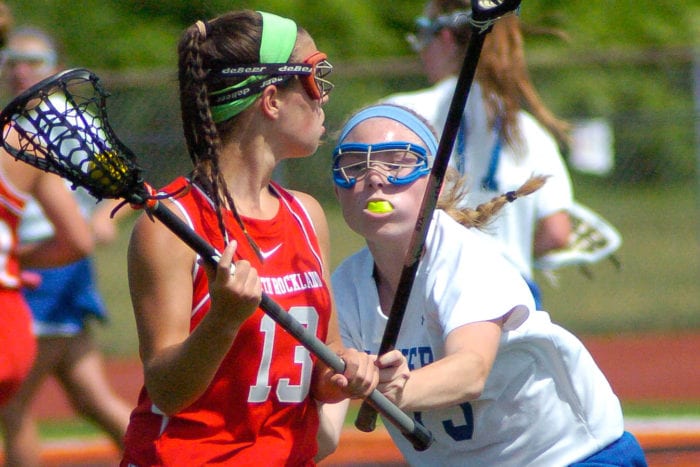 Shaker’s Lauren Brock stops a North Rockland player from driving to the goal 
during the Class A regional final Saturday, June 4, at Mohonasen High School. Rob Jonas/Spotlight