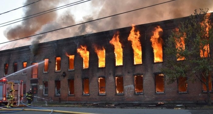 Firefighters combated against 80-degree heat and explosions, as they battled for nine hours to contain a fire that consumed a Broadway warehouse in Watervliet on Saturday, June 25.	 Photos by Sidewinder Photography