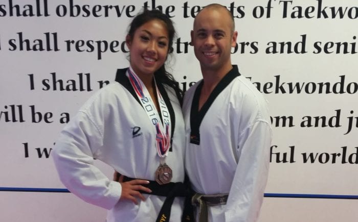 Jamie Lam, left, pictured with Pil Sung Taekwondo owner Joe Hasan, qualified for the AAU USA National Team Trials in September. Submitted photo