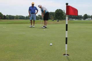 Eric King (left), President of Equinox Companies, and Charles Cronin practice their putting before the start of the 23rd annual Salvatore R. and Anna E. Beltrone Golf Classic at Schuyler Meadows Club on July 25. Submitted photo