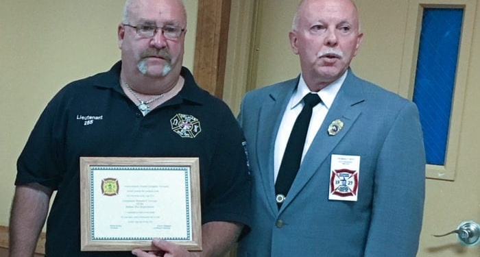Michael Gervais, left, and Delmar Fire Department Chief Daniel Ryan, Jr. stand together after Gervais was awarded Fire Policeman of the Year by the Hudson Mohawk Volunteer Firefighters’ Association on Wednesday, Sept. 28.  				   Submitted photo