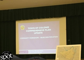 Michael Welti presents the town's Comprehensive Plan to residents at Forts Ferry Elementary School (photo by Kassie Parisi/spotightnews.com)