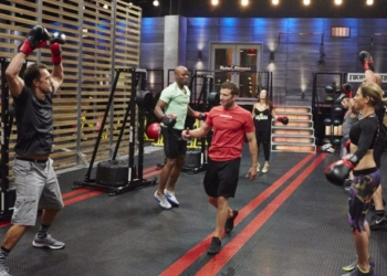 Kyle Coletti (middle) addresses the cast of the Jillian Michaels’ television series “Sweat Inc.” on SpikeTV. Now, Coletti runs Focusmaster Fitness Studios from two locations. Submitted photo