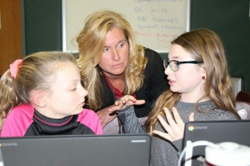 Superintendent of Schools Jody Monroe learns about the importance of technology in education from Slingerlands fifth-graders // Photo: BCSD