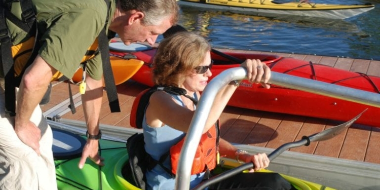 Bethlehem Supervisor John Clarkson helps Assemblywoman Pat Fahy into her kayak at the August unveiling of the new kayak launch at Henry Hudson Park in Selkirk // Photos: Ali Hibbs