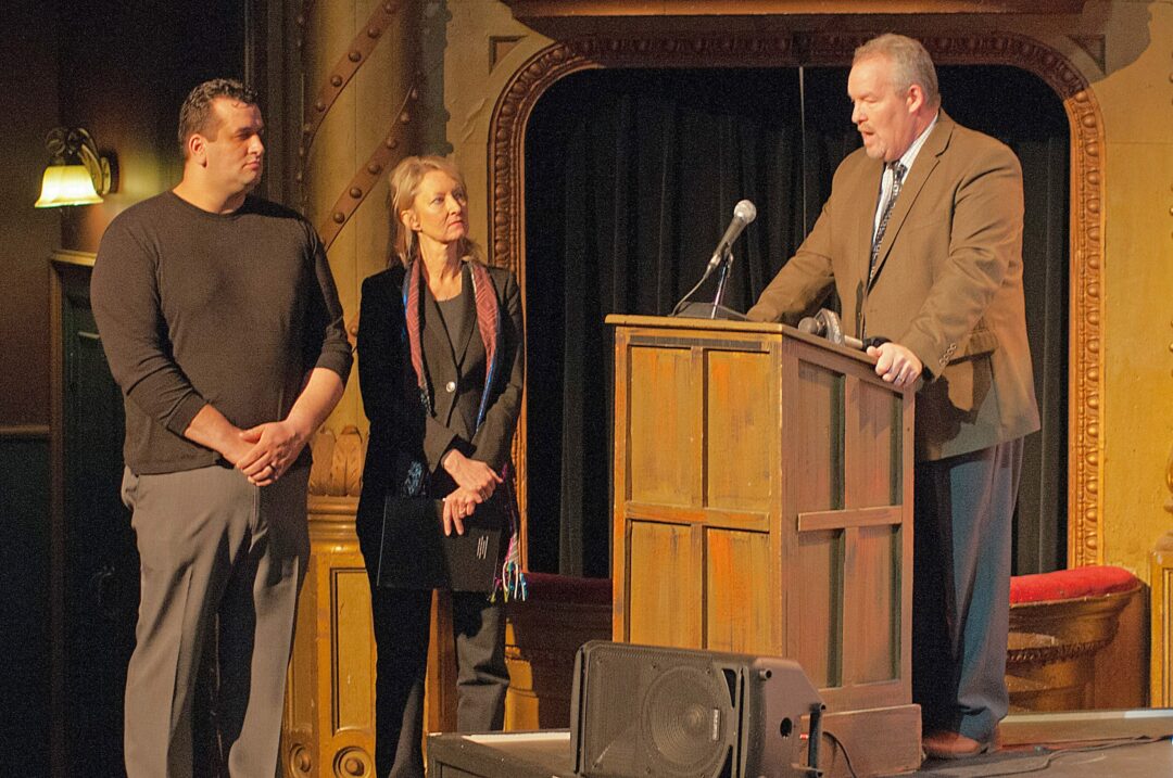 Cohoes Mayor Shawn Morse, flanked by Palace Theatre Executive Director Holly Brown and Comedy Works owner Tommy Nicchi, announces the newly minted partnership between the comedy group and Cohoes Music Hall. (Photo by Michael Hallisey/TheSpot518)