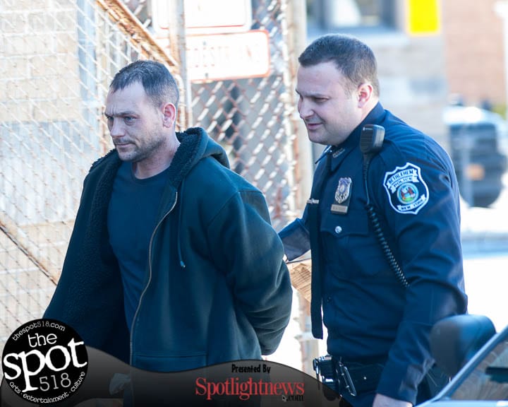 Tyler Hunt is escorted into the Bethlehem Police Department (Photo by Jim Franco/Spotlight News)