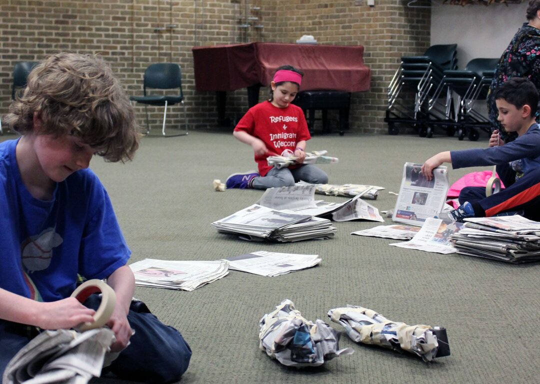 Young engineers craft chairs out of newspapers during a STEM program at the library on Tuesday, March 28.
 
CREDIT: Kristen Roberts