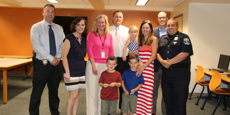 Det. Chad Rice, back and center, and family stands with members of the Bethlehem Central School District and Bethlehem Police Department.  Rice served as the school district’s resource officer for mor than a decade. Photo submitted