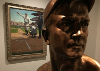 A bust of pitching great Christy Mathewson looks off into the distance as a painting of Babe Ruth in the background captures the slugger as he postures in his famous “Called Shot” during Game 3 of the 1932 World Series against the Chicago Cubs.
Michael Hallisey / TheSpot518