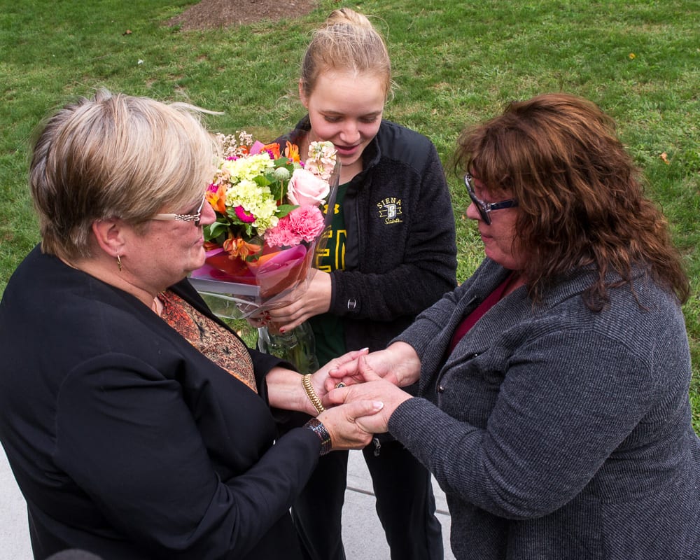 Cathy and Veronica Forth meet Reeny Milton for the first time on the Siena Campus Jim Franco / Spotlight News