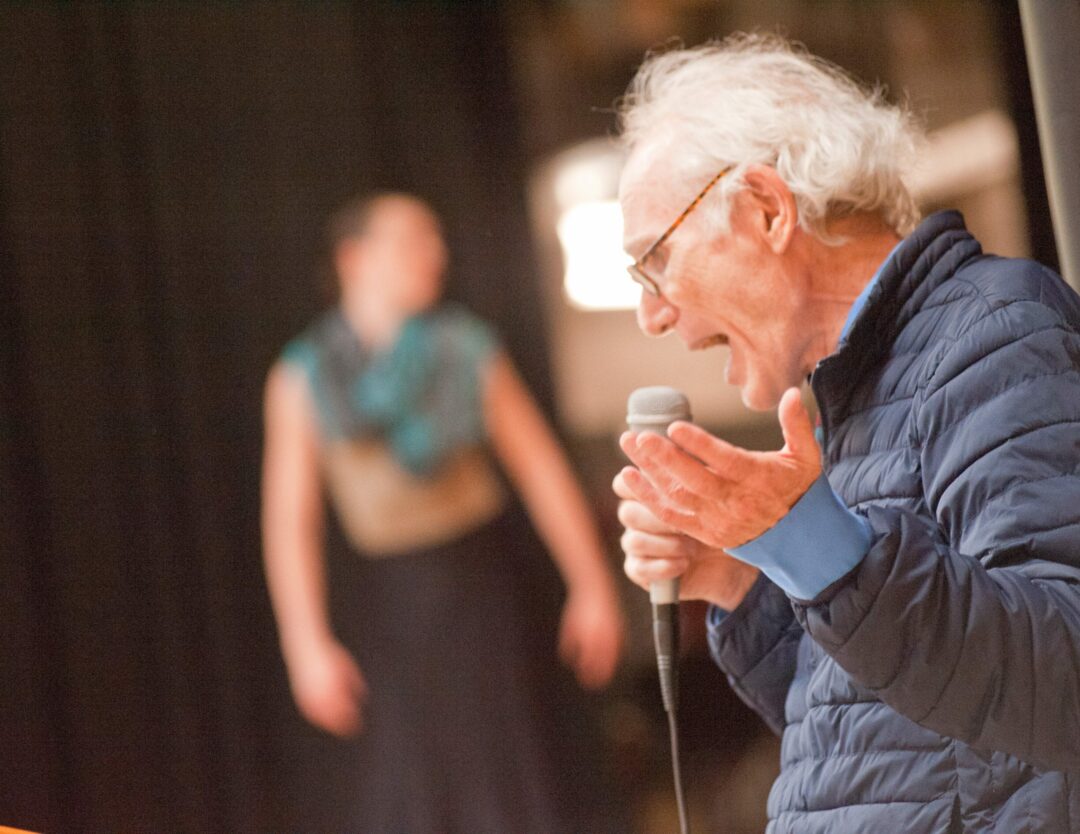 David Ira Rottenberg with a dancer in the background. Photo by Michael Hallisey / Spotlight News