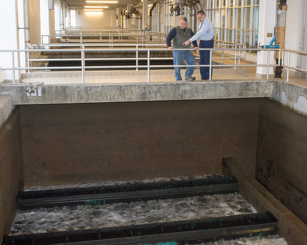 In 2019, Latham Water District Superintendent John Frazer Jr. (right) and Dan Marshall, the chief water treatment plant operator, watch massive water filters get cleaned.
Jim Franco / Spotlight News