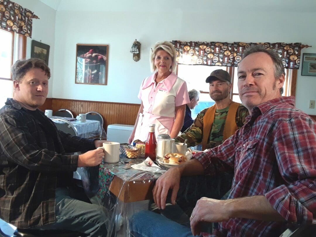 "Garrow" featured actors from upstate New York — in the same communities terrorized by Robert Garrow himself. L-R: film producer Joel Plue, actress Bunny Easter Christmas as a diner waitress, and actors Bob O'Brien and John Love as patrons.
Adirondack Films, LLC