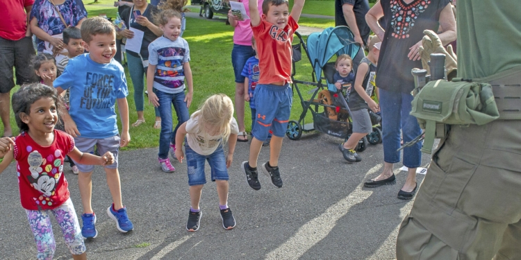 Local kids jump for joy as families and law enforcement officers enjoy a special community day.Photos by Jim Franco / Spotlight News
