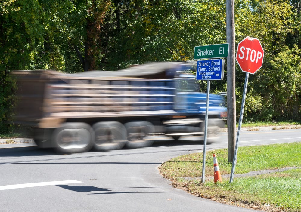 A truck speeds along Albany Shaker Road at the Shaker El intersection (Jim Franco/Spotlight News)