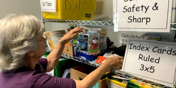 Volunteer Lynda Bissonnette, above, is among several volunteers who helped organize the donated supplies in the town’s food pantry and fill backpacks with them.
Diego Cagara / Spotlight News