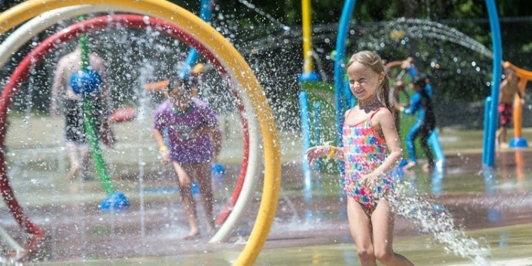 A young girl enjoys the Colonie splash pad shortly after it opened in 2018 (Jim Franco/Spotlight News)