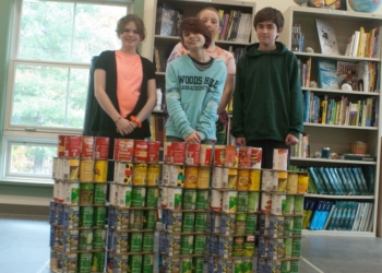 Woodland Hill Montessori School students show their incomplete structure which is erected with over 300 cans and pizza box cutouts. It will be completed with over 1,000 cans and displayed at Crossgates Mall on Monday, Nov. 12,  along with structures made by three other Capital District schools. This “can-paign“ addresses food insecurity and will benefit local food pantries.
Diego Cagara / Spotlight News