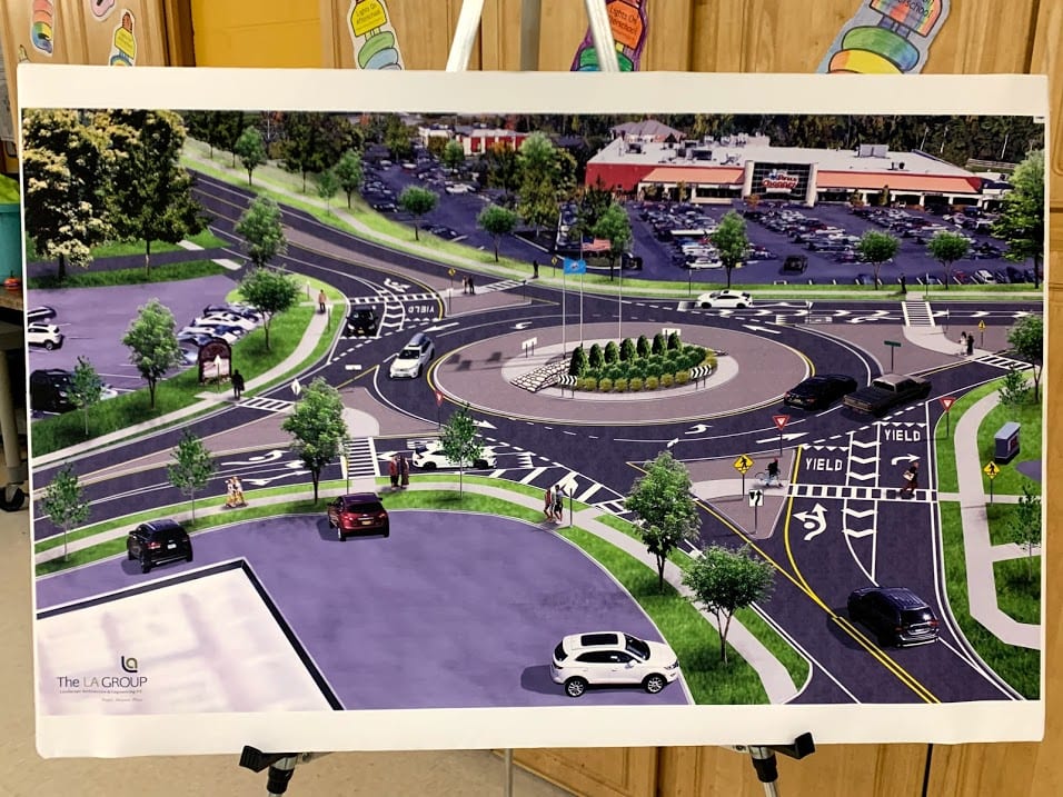 An artistic rendering of the chosen hybrid roundabout design was shown at the Nov. 14 open house. The center island is proposed to have a flag pole, a stacked wall and landscaping. Diego Cagara / Spotlight News