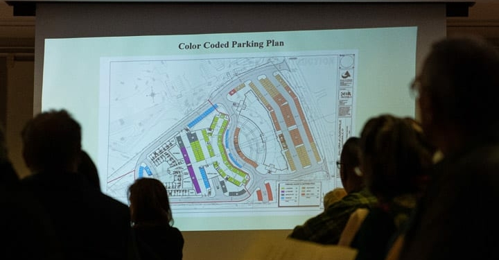 Residents look at the parking plan for the proposed retail/senior housing facility at the former Hoffman's Playland site during a Planning Board meeting on Tuesday, Nov. 26 (Jim Franco/Spotlight News)