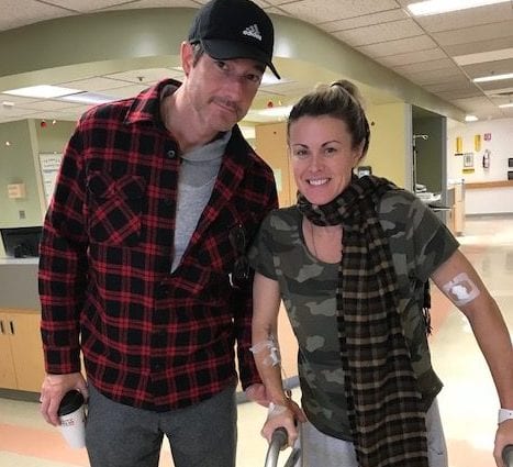 Jennifer DeFazio walks through the hospital with husband Jason as she attends physical therapy after suffering through two strokes. Provided photo