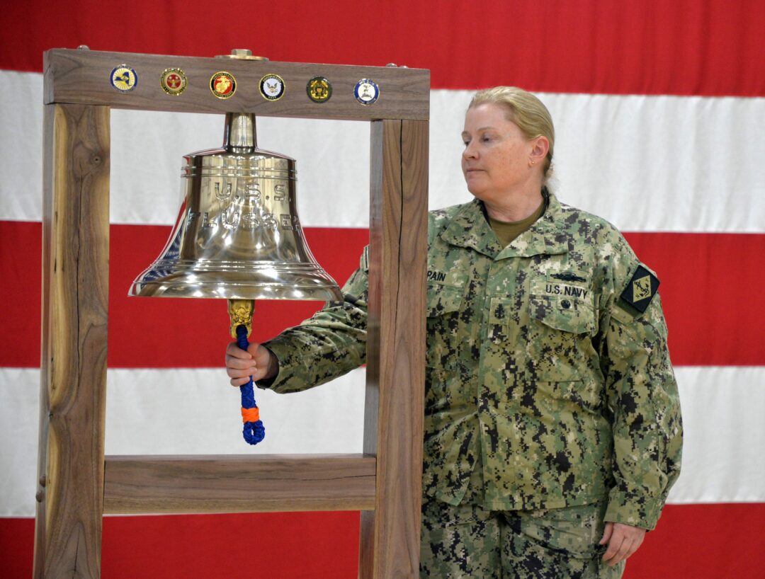 Senior Chief Boatswain’s Mate Elizebeth Spain rings the re-dedicated U.S.S. Flusser bell at the Division of Military and Naval Affairs in Latham on Tuesday, Feb. 25. 
Photo submitted
