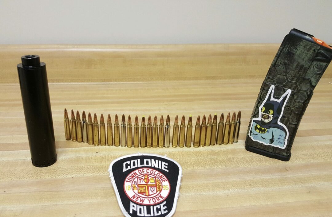A silencer and ammunition allegedly found on Anthony Martinelli. (Colonie Police Department)