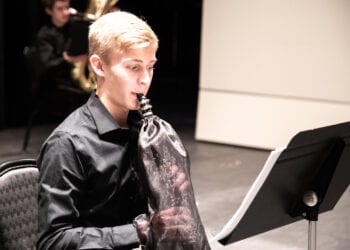 Wind instruments are of particular concern when attempting to mitigate the spread of the virus. Players perform while placing their instruments in special bags to contain particals.

Empire State Youth Orchestra