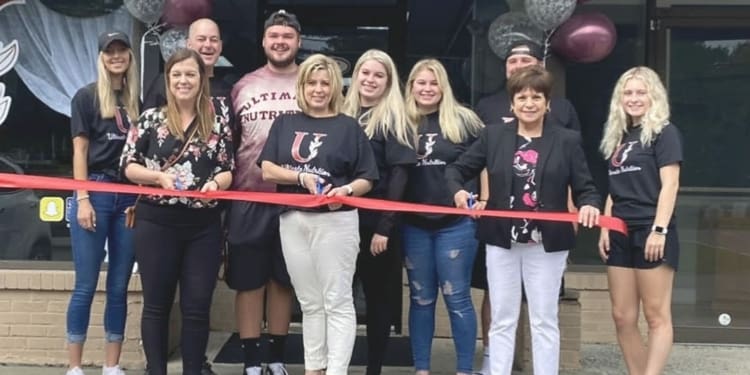 The ribbon cutting at Ultimate Nutrition. Kellie Acker is front and center 
Photo provided
