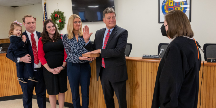 Colonie Town Supervisor Peter Crummey, who was elected last year, is sworn in by U.S. Judge Mae D’Agostino while Sandy Oakley holds the Bible. His daughter, Carol Crummey McCardle, along with her husband, Jon McCardle, and their daughter, Elizabeth, were also present on Saturday, Jan. 1, 2022 at Town Hall. (Jim Franco/Special to the times Union)