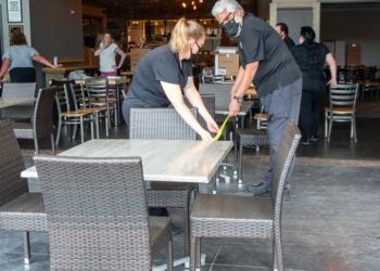 John LaPosta, owner of Innovo Kitchen in Latham, makes sure his tables are six feet apart in response to Gov. Andrew Cuomo allowing restaurants to offer outdoor dining while maintaining 6 feet of social distance (Jim Franco/Spotlight News)
