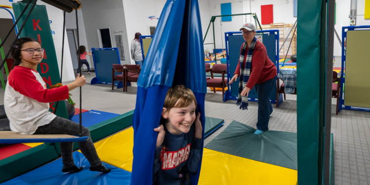 Jacob Shapiro and Carabelle Audi have fun on the swings at the Bring on the spectrum sensory gym which opened on Fuller Road earlier this month.
Jim Franco / Spotlight News