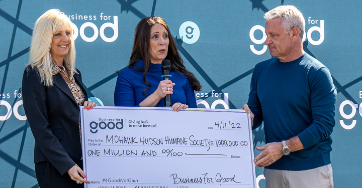 Mohawk Hudson Humane Society CEO Ashley Jeffrey Bouck (center) accepts a $1 million check from Lisa and Ed Mitzen, co-founders of the Business for Good foundation.
Jim Franco / Spotlight News