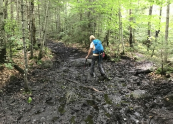 A hiker navigates ADK mud in 2019. (Jim Franco/Spotlight News)