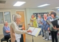 Marie Liddle conducting the Friendship Singers during rehearsal at Delmar Reformed Church