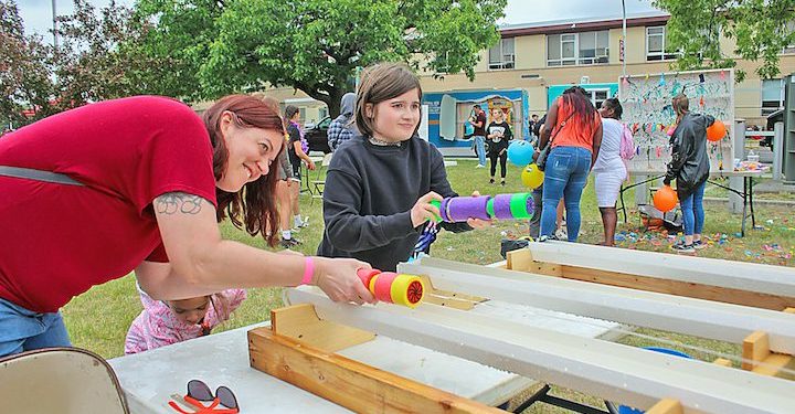 A family taking part in a game during Raiderfest at Colonie HS Saturday, May 20.