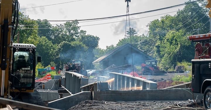 Crews are removing the failed rail trail bridge in Slingerland on July 28.