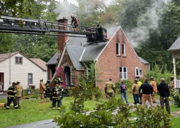 Firefighters battle a house fire at 70 Elsmere Avenue on September 18. Photo courtesy of Michael Hallisey.