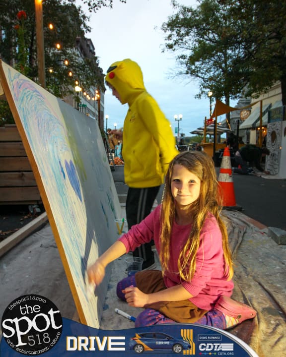 Local artists taking part in the evening event, "Grafitti Night", outside Bootlegger's in Troy, Saturday, October 14, 2023.