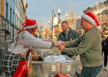 Event goers picking up some chili and chowder from Savoy Taproom on Lark Street in Albany, NY, Saturday, Dec. 9, 2023.