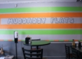 Muddaddy Flats painted signage inside the restaurant in Troy, NY, Wednesday, February 7, 2024.